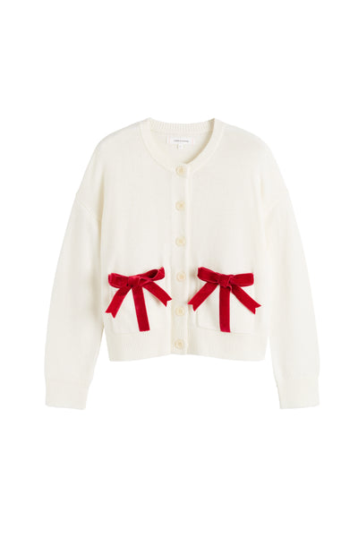 White cardigan with red bows on a white background