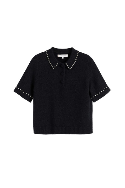 Black blouse with studded details on a white background