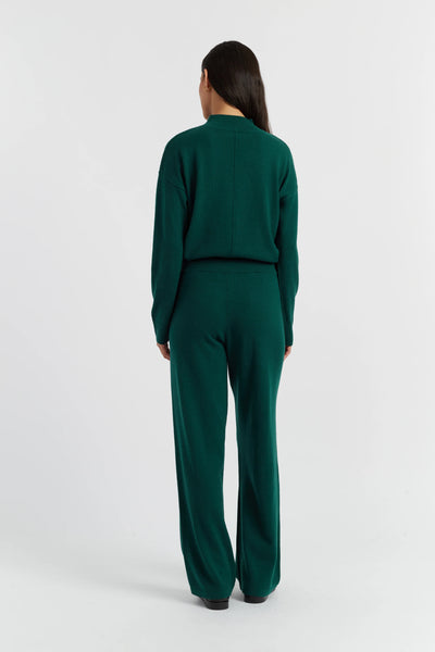 Person wearing a green outfit on a white background