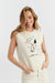 Woman wearing a sleeveless sweater with a Snoopy design on a white background