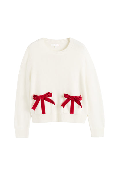 White sweater with red bows on a white background