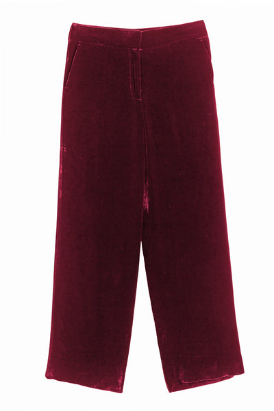 Maroon velvet pants on a white background