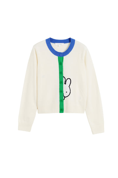 Cream cardigan with blue collar and green zipper on a white background