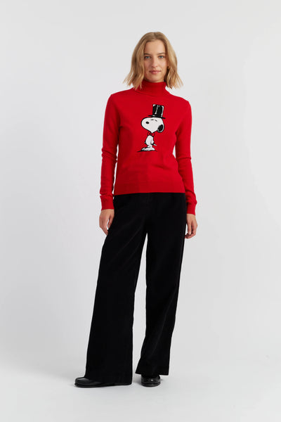 Person wearing a red sweater with a graphic design on a white background